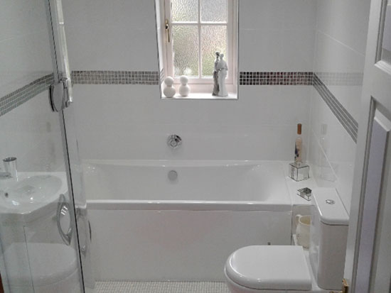 White bathroom with silver mosaic tiles