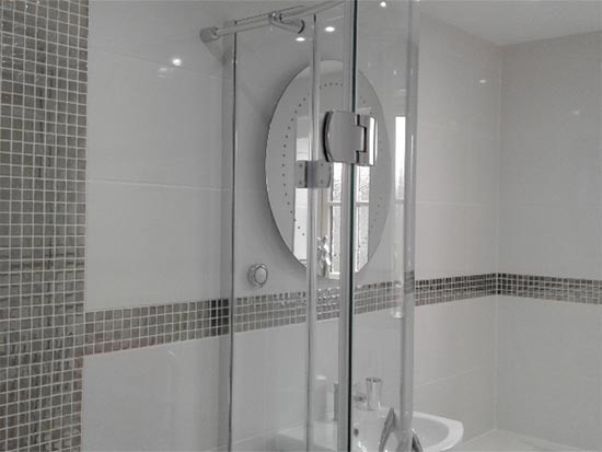 White shower room with silver mosaic tiles